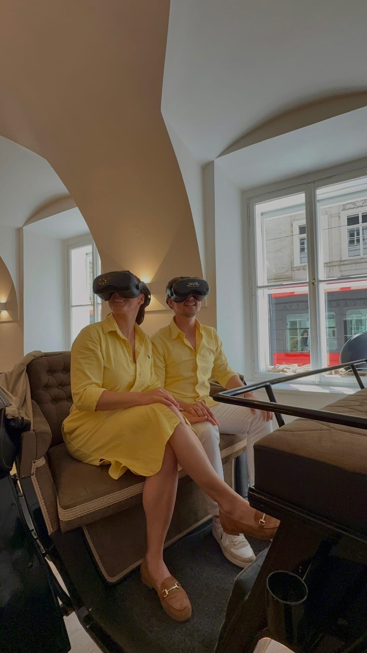 Guests sitting in the historic carriage wearing virtual reality headsets
